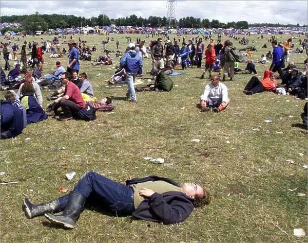 Revellers lying on the grass at Glastonbury Festival 1999 A©Mirrorpix