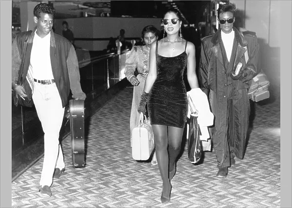Five Star pop group walk through airport c. 1986