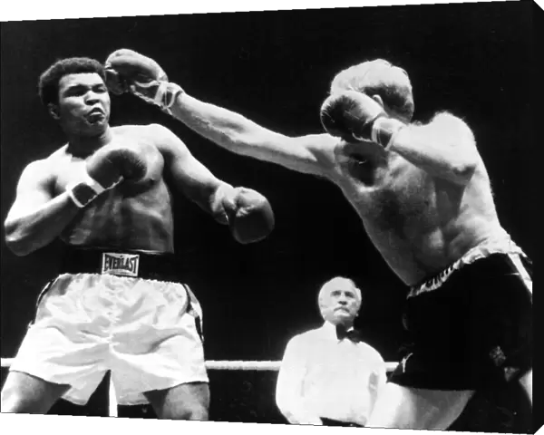American Heavyweight Champion of the World Muhammad Ali in action against Richard Dunn of