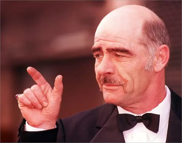 Sean Connery lookalike February 1198 John Garland wearing bow tie pointing finger