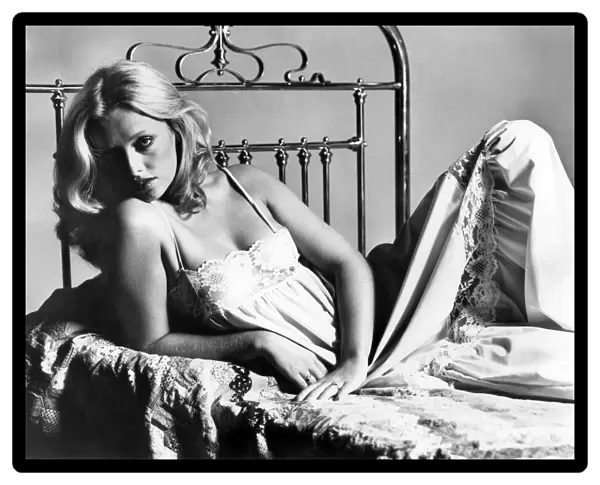 Clothing Underwear. Model reclining on bed. Sepetmber 1975 P018267