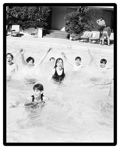 Holiday makers bathing in the pool at the Robert Meyer Hotel, Orlando, Florida, USA