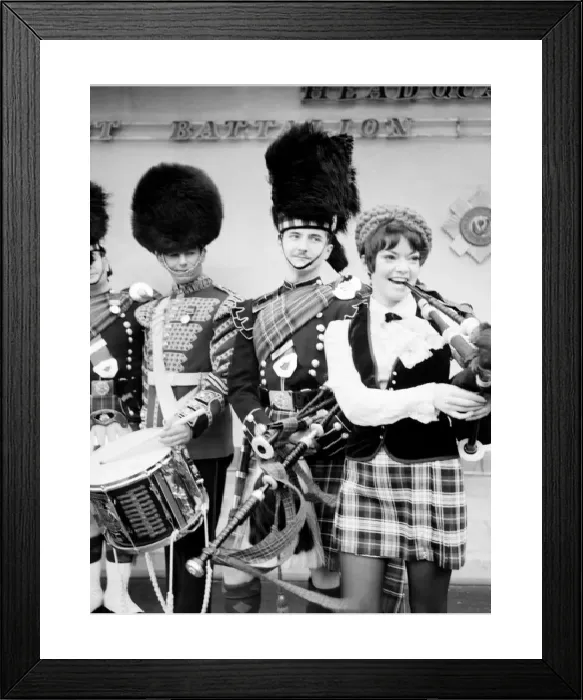 Framed Print : Black and white print of a young woman attempting to play the bagpipes Framed Print : Black and white print of a young woman attempting to play the bagpipes