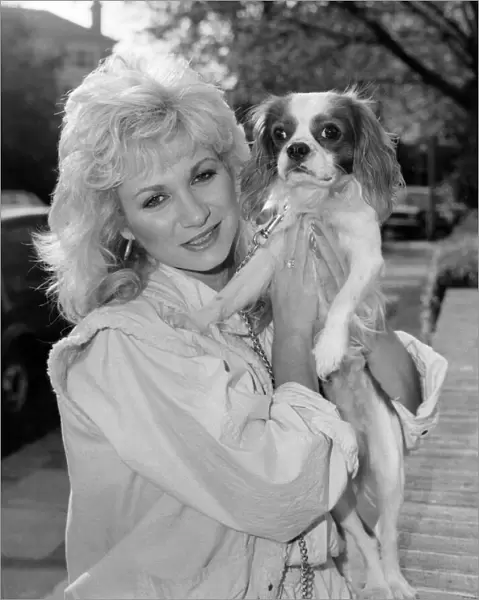 Actress Debbie Arnold, pictured at her flat with her King Charles spaniel