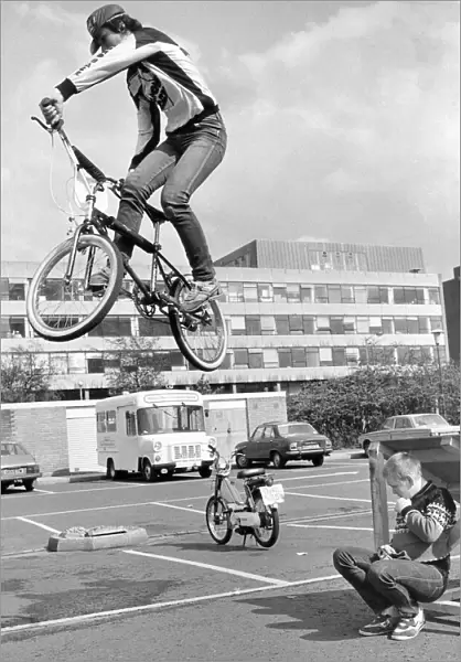 Stunt rider Andrew Bell of Team conway BMX team leaps over fellow club member Mark Taylor