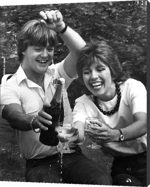 Television presenter Maggie Philbin and husband Keith Chegwin celebrating with a bottle