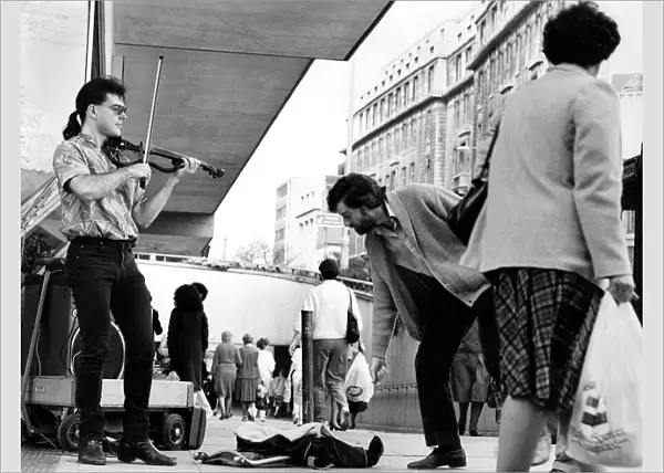 Buskers working in the streets of Birmingham. May 1985 P004925