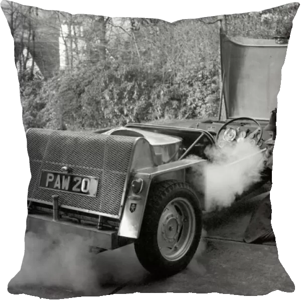 Man driving a steam powered car near his home December 1970 70-11615-002