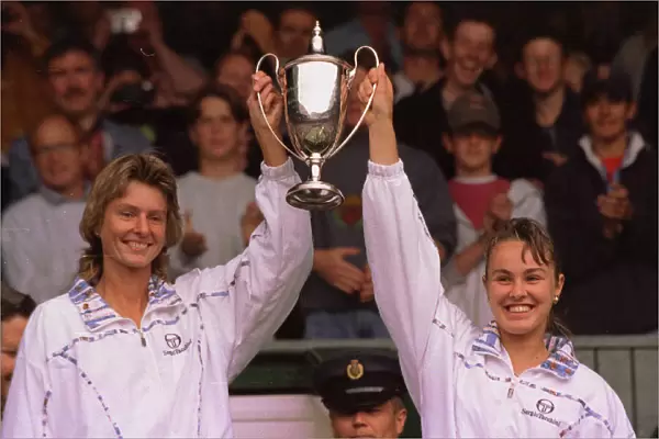 Martina Hingis and Helena Sukova celebrate winning the womens double final at Wimbledon