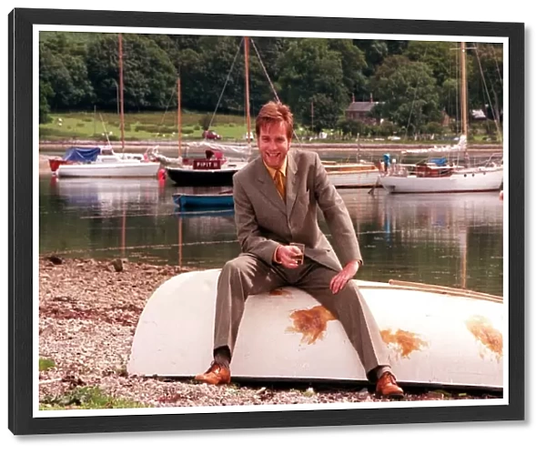 Ewan McGregor on the Isle of Arran July 1998 with glass of Loch Ranza whisky sitting