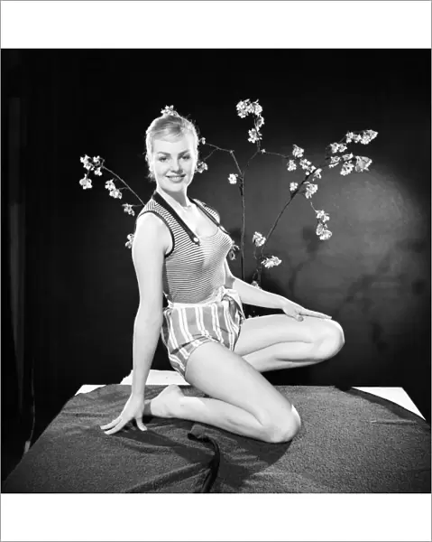 Ruth Calvert seen here modelling the latest 1959 springtime fashions posing with blossom