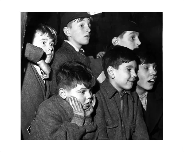 Schoolboys watching an exhibit at The Horticultural Hall They can stand on a Naval