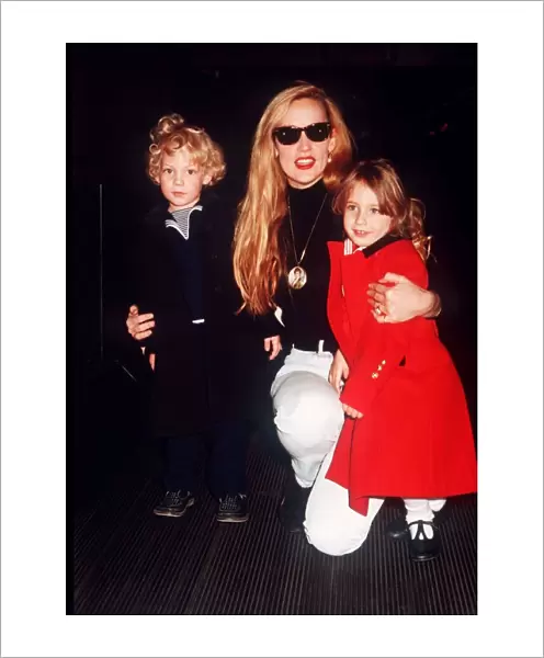Jerry Hall model with children Elizabeth Scarlet and James at Heathrow airport leaving