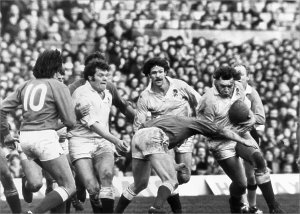 France beat England at Twickenham. England Lock Bill Beaumont leads a charge by