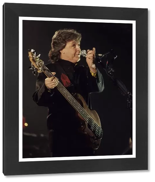 Paul McCartney former Beatles singer sings on stage. January 1990