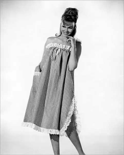 Reveille Fashions: Jo Waring. wearing a three quarters length night dress