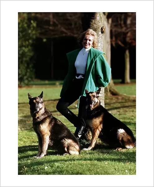 Rosemary Conley UK diet & fitness expert poses for a photograph while exercising her pet