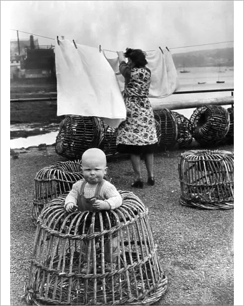 Mrs Lorna Barnicoat of North Quay House, Falmouth, Cornwall hangs out her washing in
