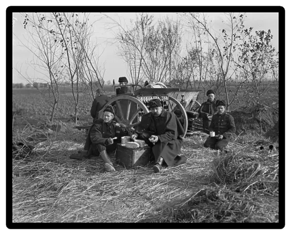 The crew of a Belgian field artillery seen here having a meal before the Geman advance