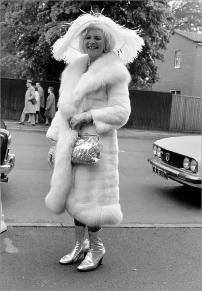 Mrs. Gertrude Shilling wearing a Ostrich feather hat with white Mink and Fox fur coat