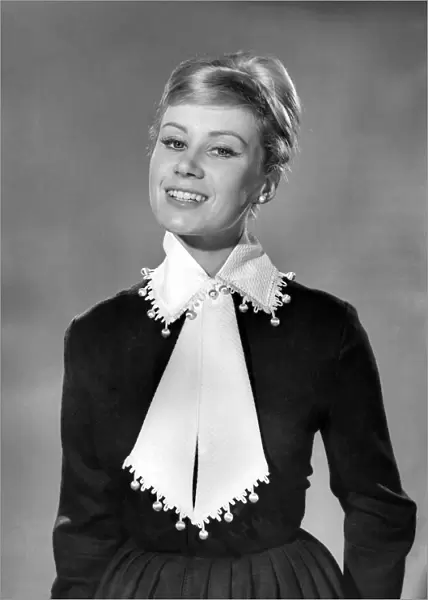 Model Rita Royce poses wearing a scarf and collar. November 1961 P007825