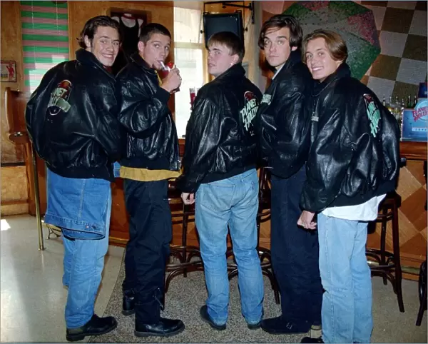 Pop group Take That enjoying a drink in a bar before a signing
