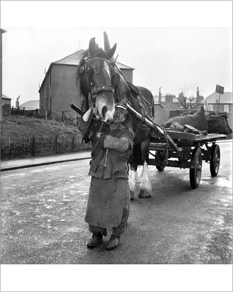 Coalman delivering coal. May 1958 A687-008