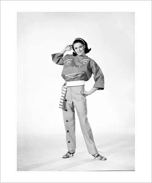 Clothing: Fashion: Woman wearing funny face trouser suit. 1964 B1723a-001