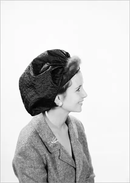Clothing: Fashion: Hats: Woman wearing mink trimmed beret. Model: Ann Cave. 1962 B1543