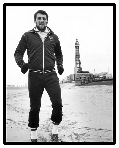 Rugby Union player and policeman Wade Dooley training on the beach at Blackpool