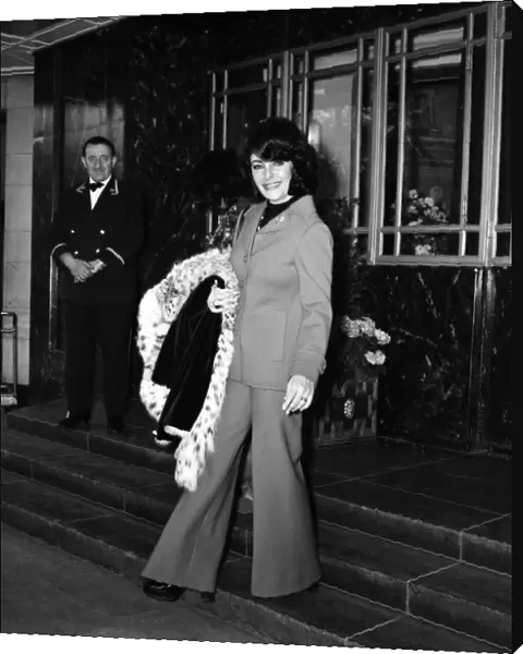 Film actress Elizabeth Taylor leaving her hotel in London as she prepares to fly to