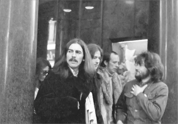 George Harrison leaves the Midland Hotel, New Street, Birmingham prior to appearing at