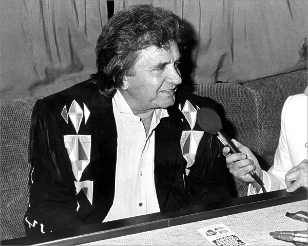 Country and Western singer Johnny Cash being interviewed before appearing at Bents Park