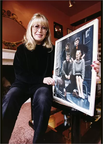 Cynthia Lennon ex wife of the late John Lennon at home with an early picture of her with
