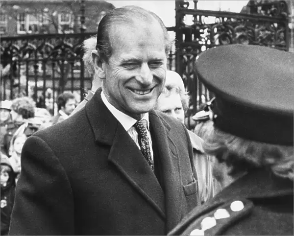 Prince Philip, Duke of Edinburgh, greets the crowd as he leaves Carlisle Cathedral