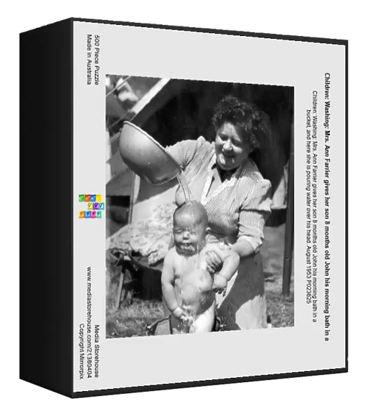 Children: Washing: Mrs. Ann Farrier gives her son 8 months old John his morning bath in a