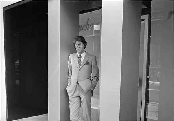 Yves St. Laurent pictured outside his new boutique in the Rue de Tournon on the left bank