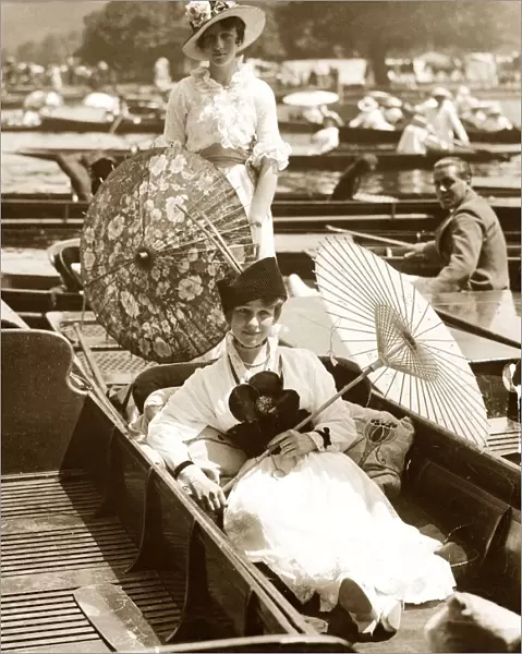 Two edwardian ladies enjoying the sun and the river at the Henley Regatta Women