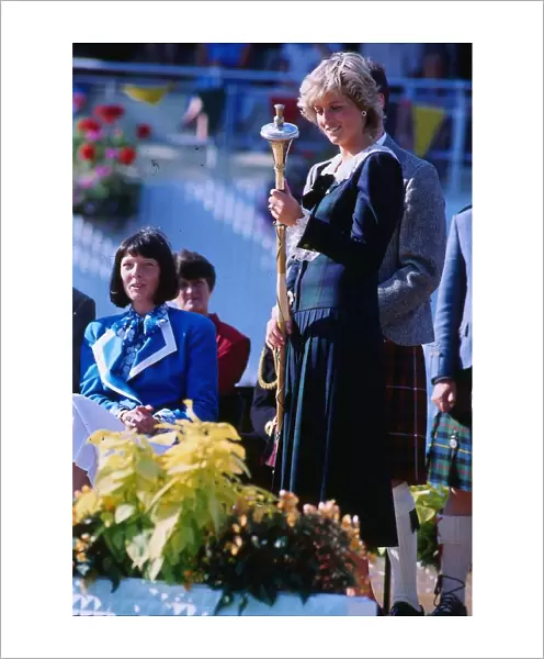 Princess Diana, Princess of Wales, holding the mace in her hand at the Rothesay Highland
