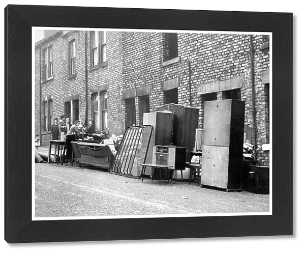 Mrs. McGeorges furniture stands outside her home in John Street