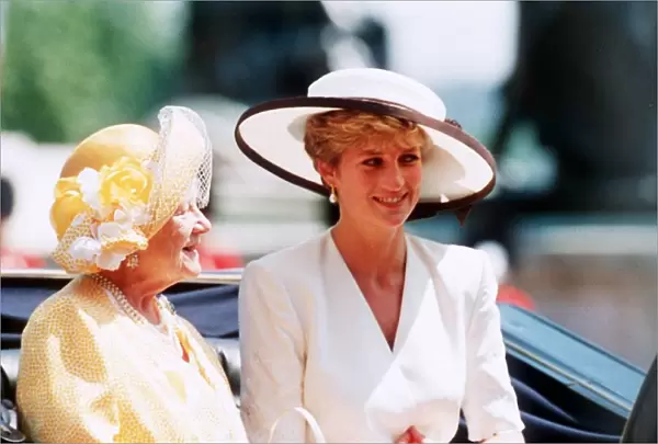 Queen Mother rides in an open top carriage with Princess Diana during the Trooping