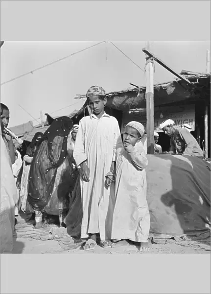 Children at the market in Abu Dhabi. July 1965 U6027