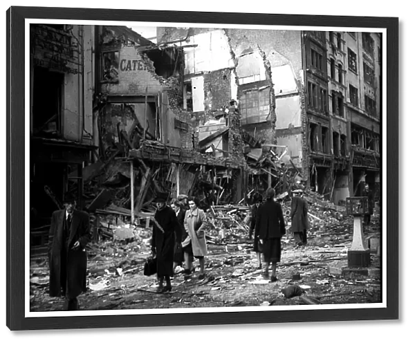 Bomb damage in London during WW2 people walking past detroyed buildings