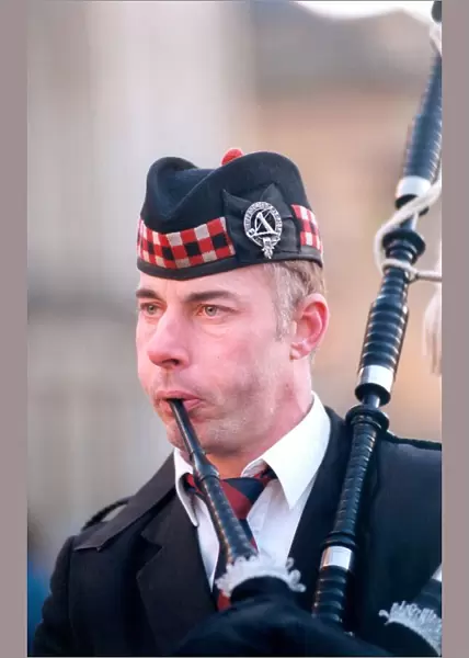 Fulton McInnes playing the bagpipes on Grey Street, Newcastle