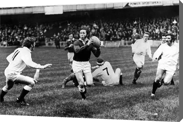 A fine study of full back JPR Williams as he breaks away for Probables in the Welsh
