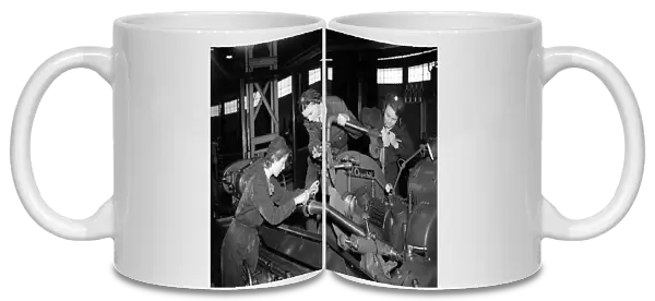 Woman Engineers working a lathe 1941 women doing mens jobs during the war years