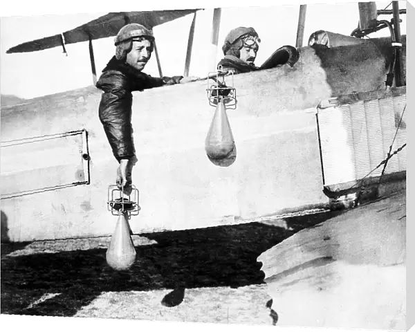 British airmen drop handbombs from their bi-plane. 1914 World War One