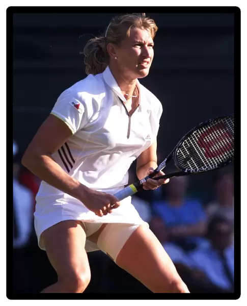 Steffi Graf tennis player at Wimbledon July 1999 with a strapped thigh while playing with
