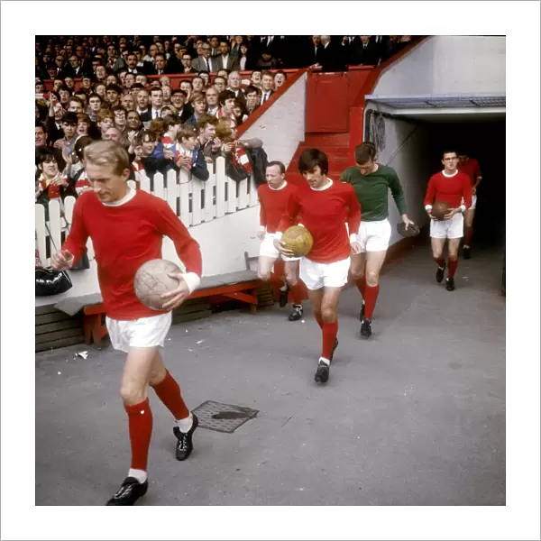 Manchester Uniteds Denis Law leads out teammates Nobby Stiles, George Best