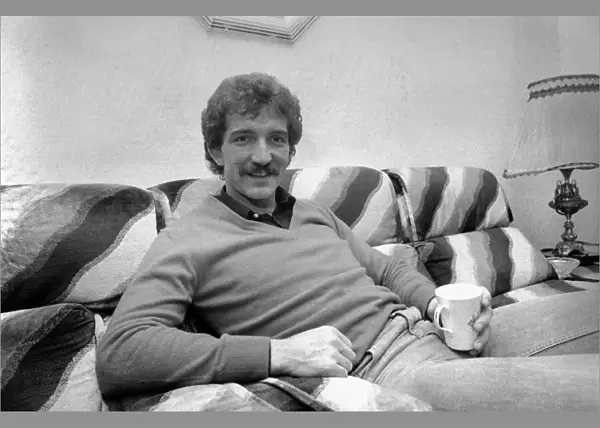 Liverpool footballer Graeme Souness relaxes at home witha cup of tea